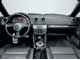 Audi TT 1.8 turbo Tiptronic. Стильный интерьер ТТ за прошедшие годы ничуть не устарел. Переключать передачи можно также нажатием кнопок на руле.