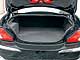 Jaguar X-Type 2.5. Багажник глубокий, однако увеличить его, сложив задние кресла, нельзя.