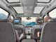 Ford Galaxy 2.0 TDCi. Подголовники передних сидений в версии Ghiа оборудованы жидкокристаллическими экранами и инфракрасными портами. Звук можно слушать через наушники.