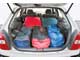 Походный размер багажника Mazda 323 небольшой, зато грузовой отсек можно увеличить, сдвинув вперед заднее сиденье, установленное на салазках. 